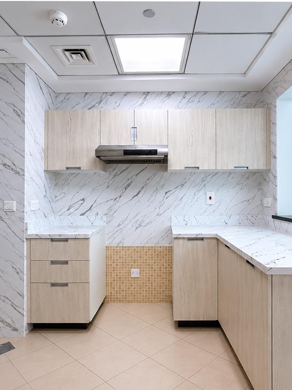 Modern kitchen after cabinet, countertop and wall wrapping in Dubai Marina