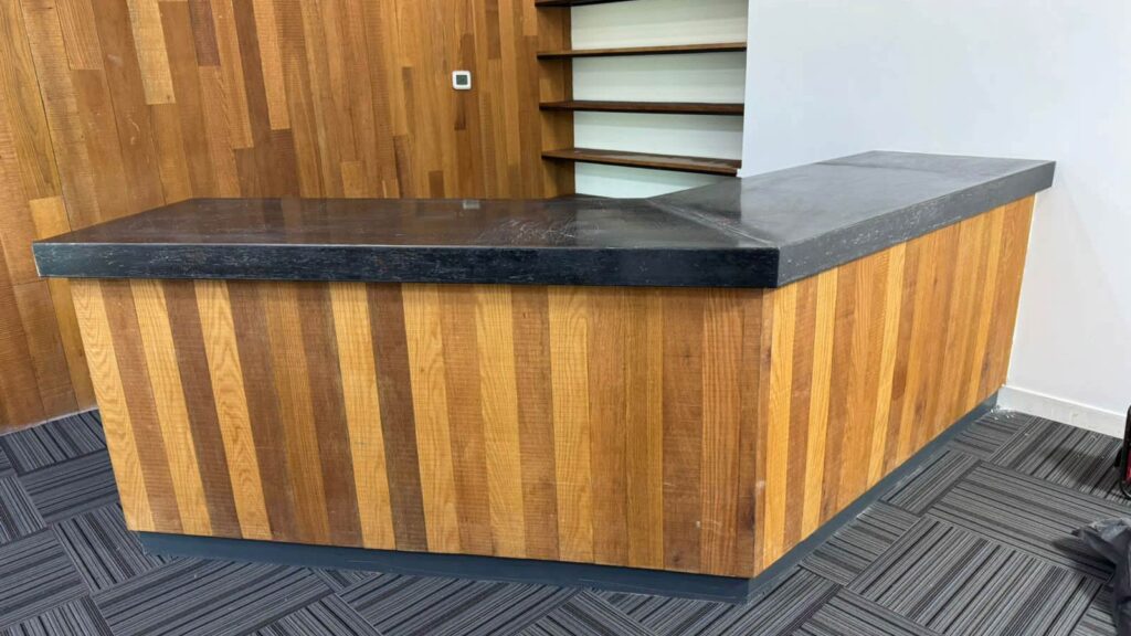 Reception counter before wrapping transformation in Downtown Dubai office