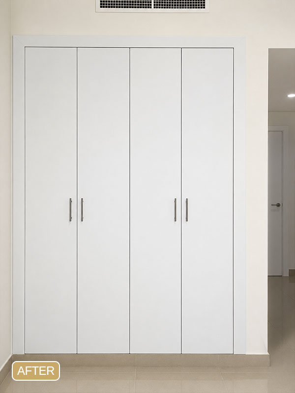After wardrobe wrapping in Jumeirah Village Triangle (JVT), Dubai, featuring a modern white matte interior film finish on the built-in wardrobe.