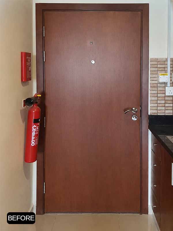 Brown interior door before vinyl wrapping in Business Bay, Dubai