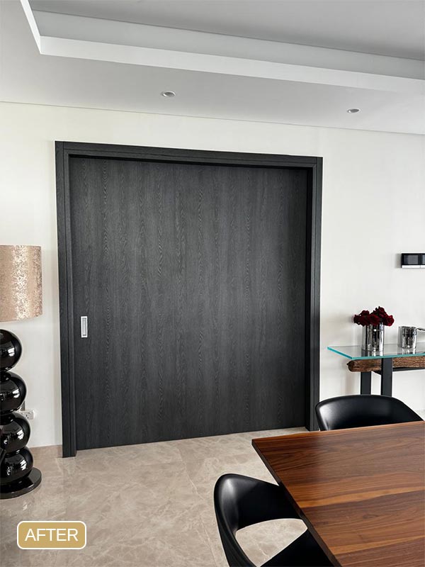 Large sliding door after dark wood vinyl wrapping in Dubai