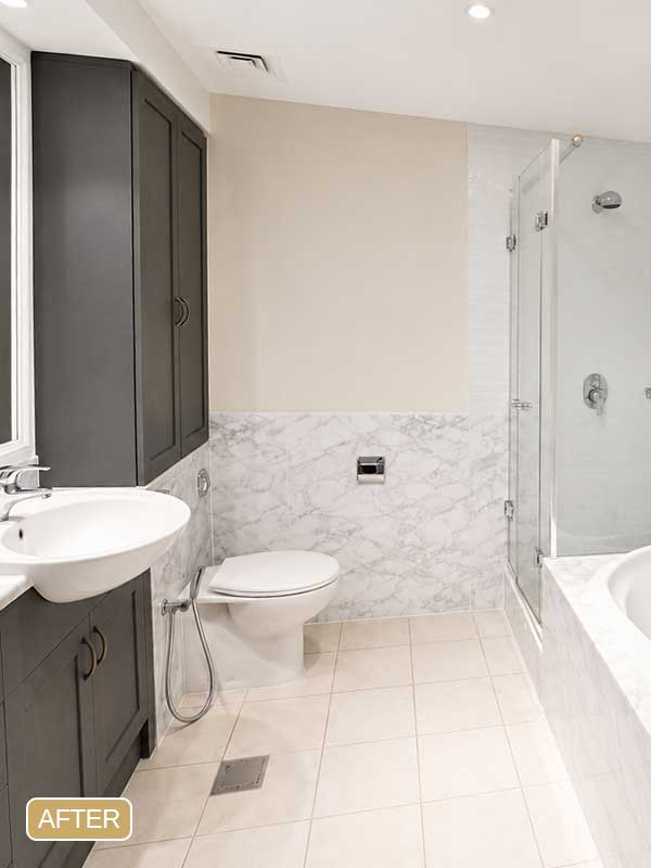 Completed bathroom wrapping project in Arabian Ranches, Dubai with marble-effect finishes.