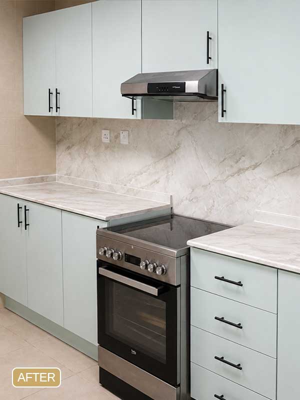 Kitchen wrapping project completed in Dubai Marina with matte sage green cabinets and marble finish